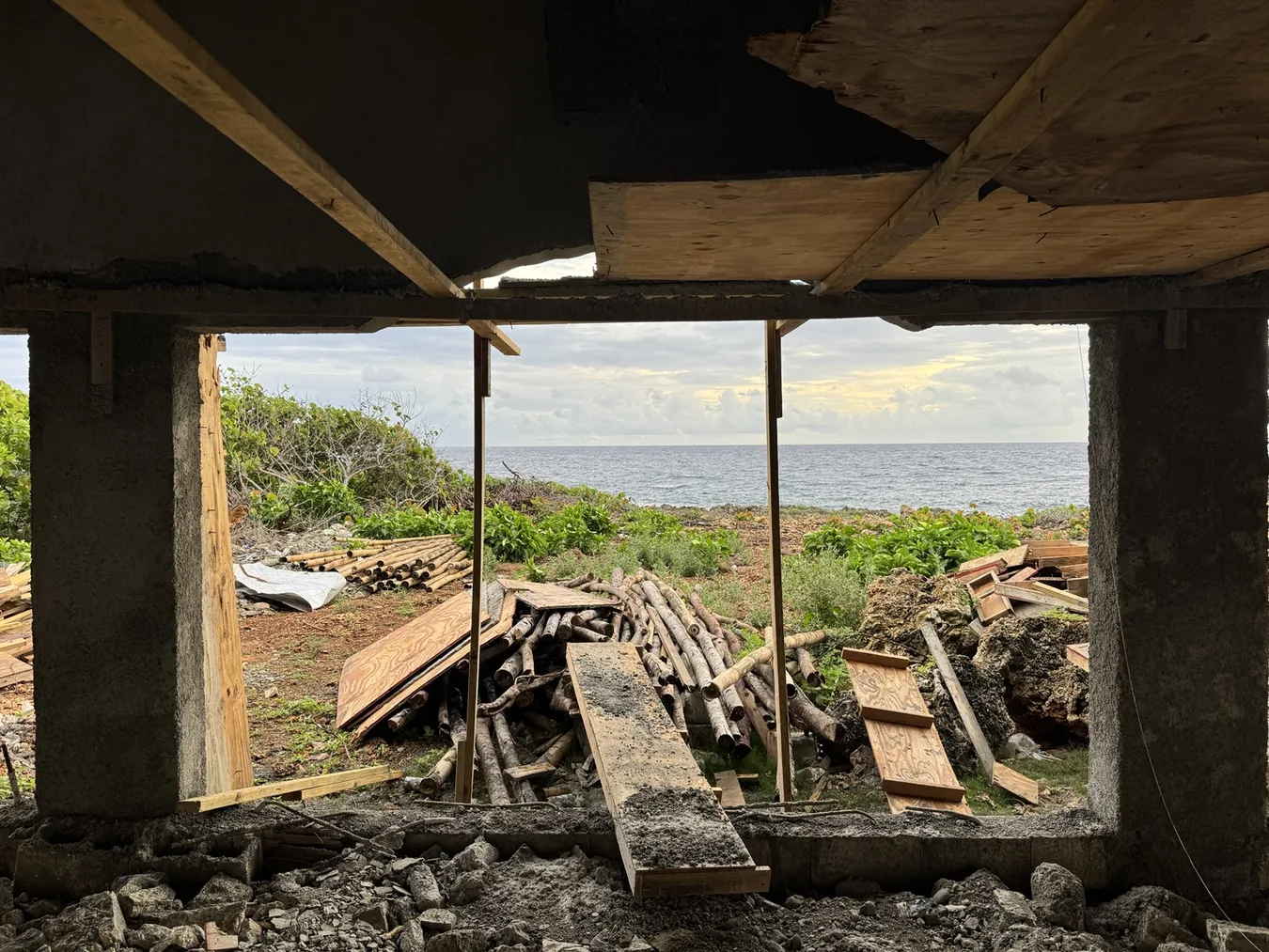 Real construction view through the unfinished Cove building toward the ocean