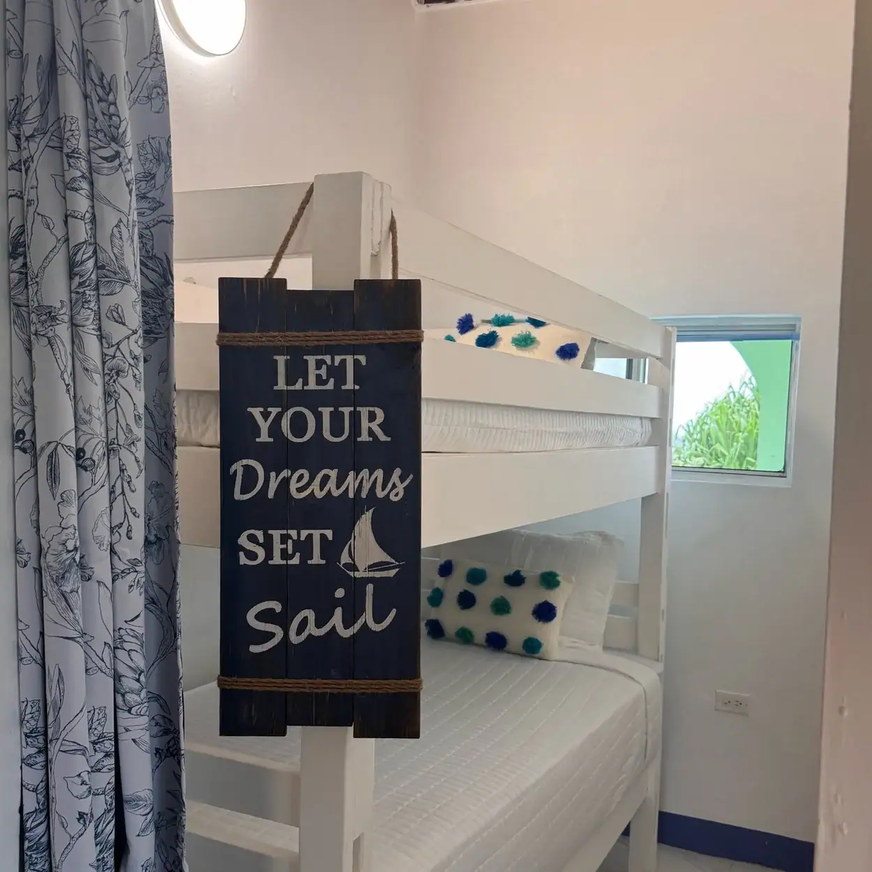 White bunk beds arranged for family guests